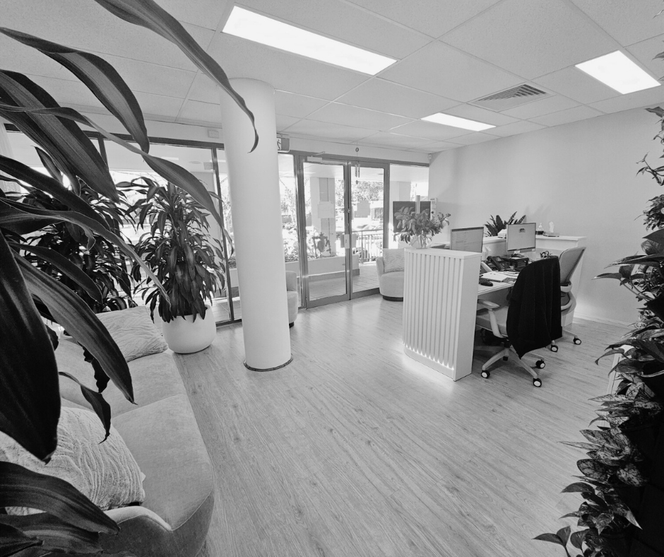 A monochrome image of the reception area at Dr Luci Clinic Caringbah