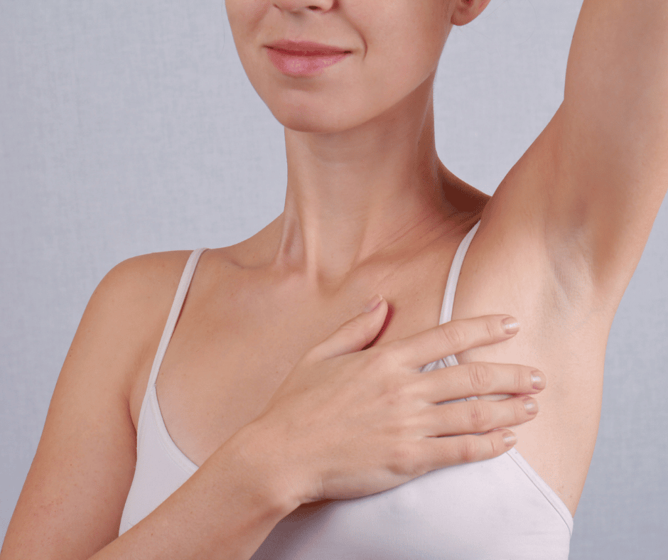 Woman with arm in air after removing excess hair