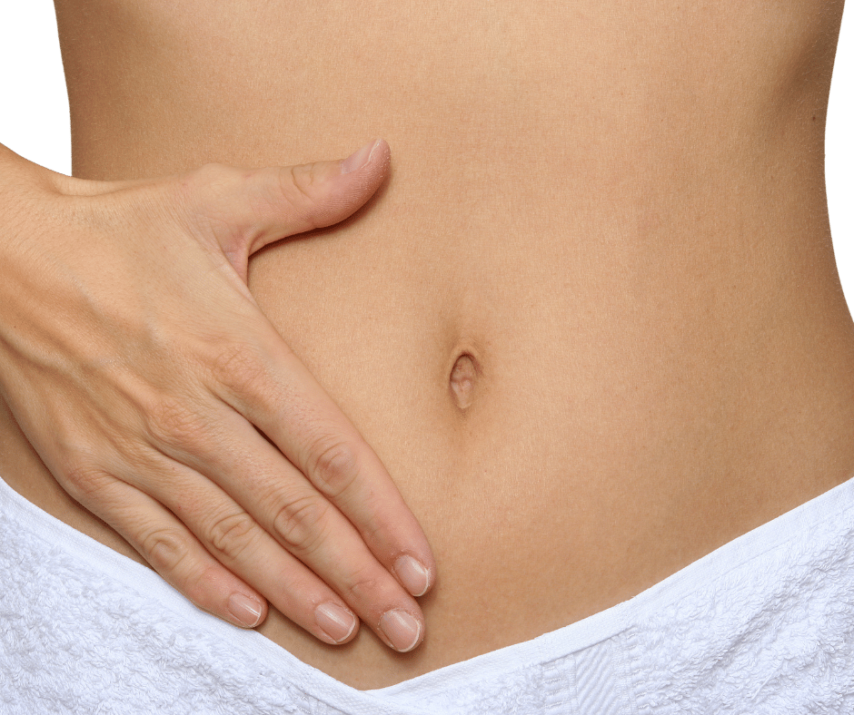 Woman holding her stomach with white towel in picture